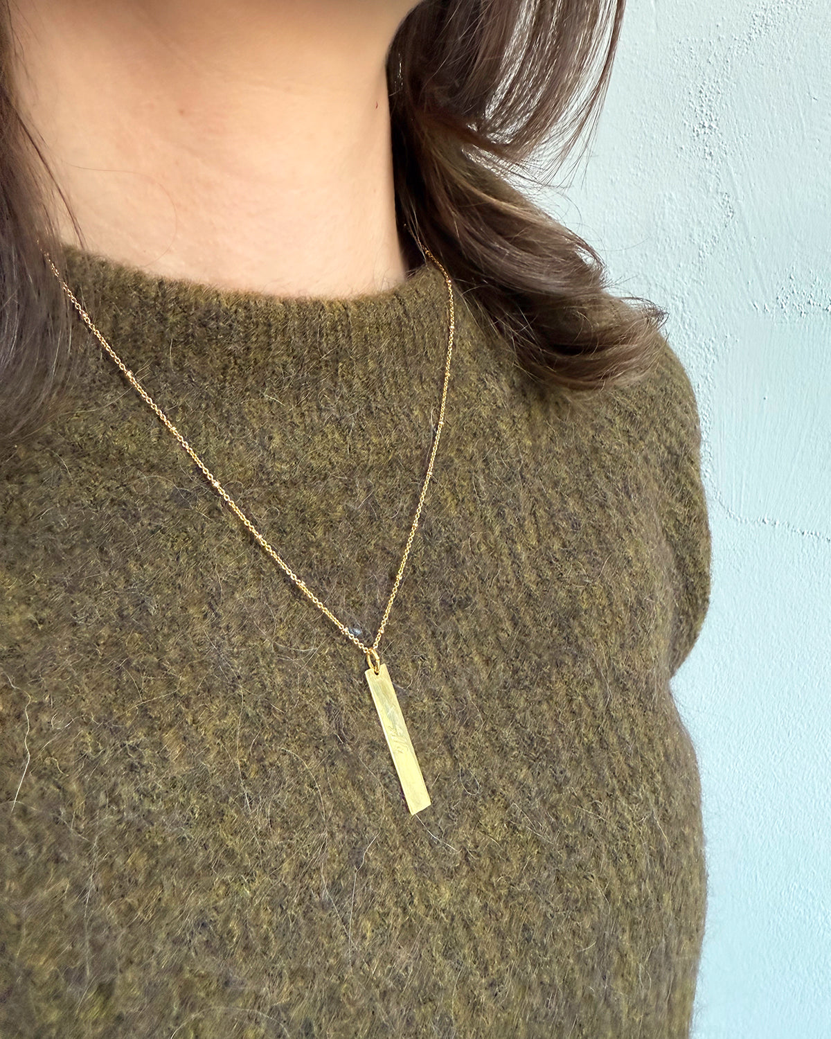 Written in gold hanger