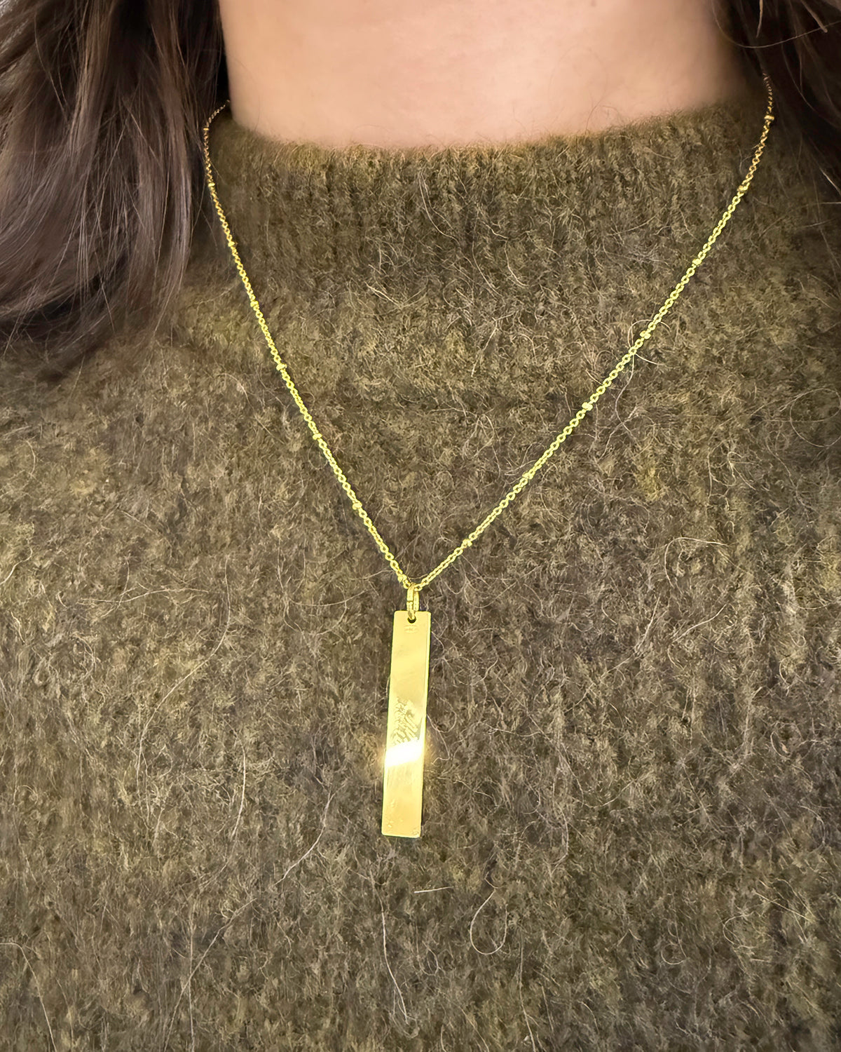 Written in gold hanger