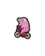 Broche fietsend varken